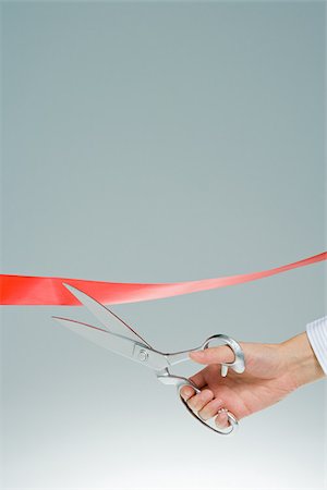 pair of scissors - Person cutting ribbon Stock Photo - Premium Royalty-Free, Code: 614-02838790