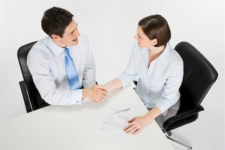 Colleagues shaking hands Stock Photo - Premium Royalty-Free, Code: 614-02933998