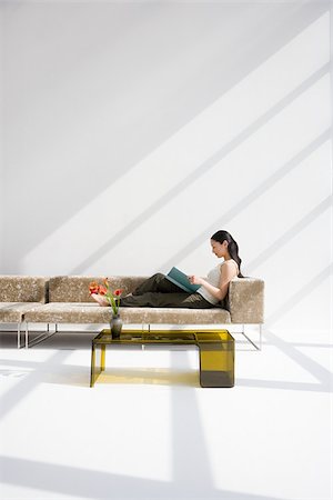 simsearch:614-02985269,k - Woman reading on a sofa Stock Photo - Premium Royalty-Free, Code: 614-02985231