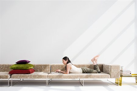 simsearch:614-02985269,k - Japanese woman relaxing on sofa Stock Photo - Premium Royalty-Free, Code: 614-02985260