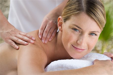Young woman receiving massage Stock Photo - Premium Royalty-Free, Code: 614-02983573