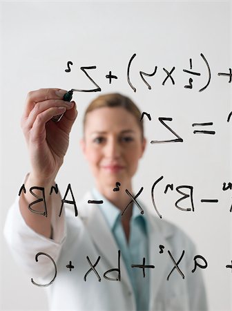 ecuaciónes - Scientist writing a formula Foto de stock - Sin royalties Premium, Código: 614-02983990