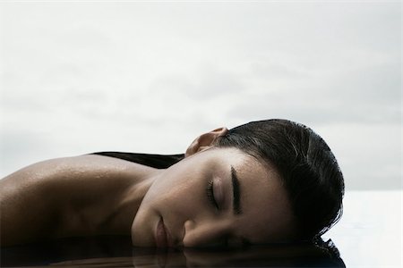 pampered - Young woman with face in water Stock Photo - Premium Royalty-Free, Code: 614-03020125