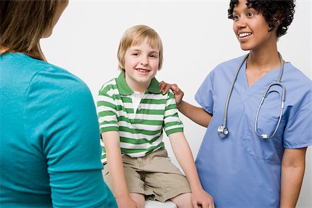 Boy with nurse and parent Stock Photo - Premium Royalty-Free, Code: 614-03020427
