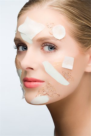 Woman with face mask and face scrub on her face Stock Photo - Premium Royalty-Free, Code: 614-03080814