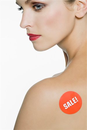 sticker - Woman with sale sign on her shoulder Stock Photo - Premium Royalty-Free, Code: 614-03191353