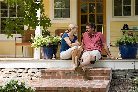 Couple sitting on porch Stock Photo - Premium Royalty-Free, Code: 614-03191474