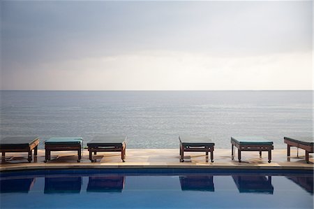 sky swimming pool - Swimming pool and ocean Stock Photo - Premium Royalty-Free, Code: 614-03241242