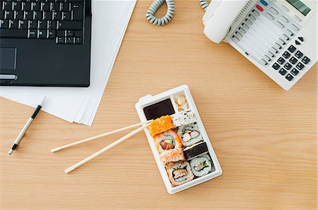 Sushi at desk Stock Photo - Premium Royalty-Free, Code: 614-03359938