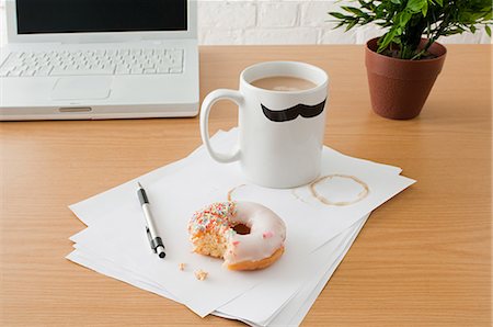 stains and discolorations - Coffee and doughnut on desk Stock Photo - Premium Royalty-Free, Code: 614-03359996