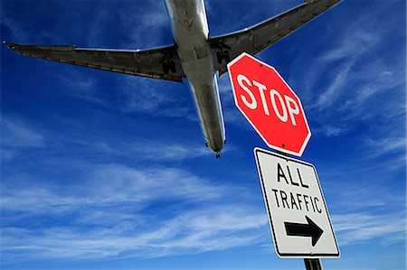 Airplane and stop sign Stock Photo - Premium Royalty-Free, Code: 614-03393525