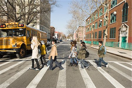 Teacher and pupils crossing road Stock Photo - Premium Royalty-Free, Code: 614-03393653