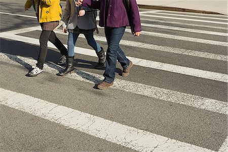 people at cross roads - Children walking across road Stock Photo - Premium Royalty-Free, Code: 614-03393668