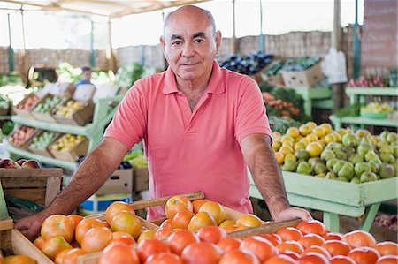 santiago - Market trader with tomatoes Stock Photo - Premium Royalty-Free, Code: 614-03393787