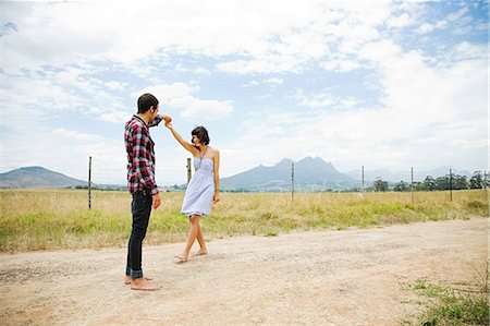 Young couple dancing in remote setting Stock Photo - Premium Royalty-Free, Code: 614-03393831