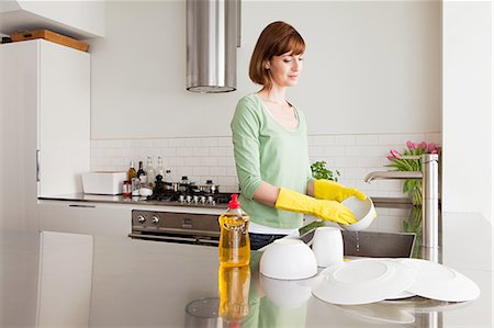 Woman washing up Stock Photo - Premium Royalty-Free, Code: 614-03455329