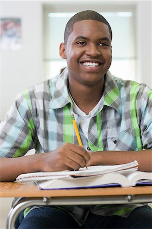 Male high school student working in classroom Stock Photo - Premium Royalty-Free, Code: 614-03551979