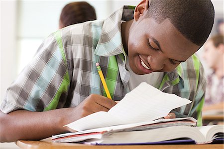 Male high school student working in classroom Stock Photo - Premium Royalty-Free, Code: 614-03552009