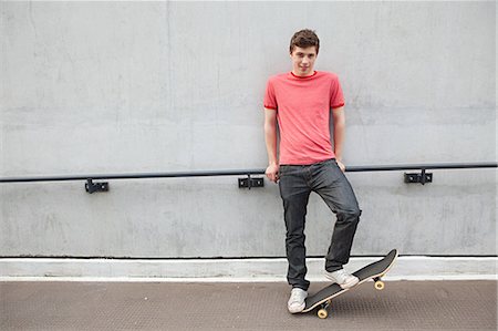 Young man with skateboard Stock Photo - Premium Royalty-Free, Code: 614-03552086