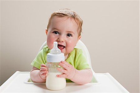 Baby boy with bottle of milk Stock Photo - Premium Royalty-Free, Code: 614-03576762