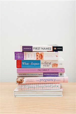 stack of books - Baby and pregnancy books Stock Photo - Premium Royalty-Free, Code: 614-03577064