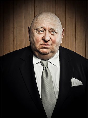 senior male overweight - Studio portrait of sad senior man Stock Photo - Premium Royalty-Free, Code: 614-03647881