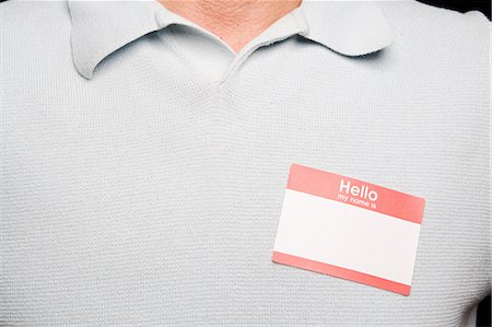 sticker - Man with blank name tag Stock Photo - Premium Royalty-Free, Code: 614-03649029