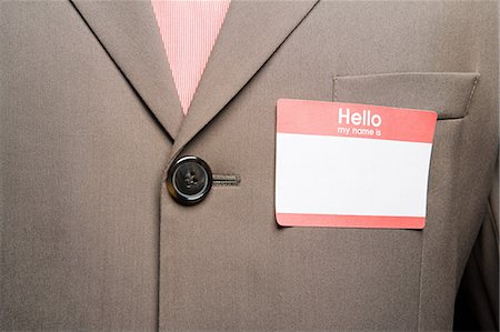 sticker - Businessman with blank name tag Stock Photo - Premium Royalty-Free, Code: 614-03649031