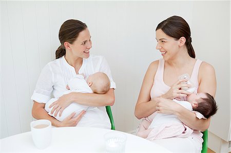 Two mothers with their babies Stock Photo - Premium Royalty-Free, Code: 614-03684078