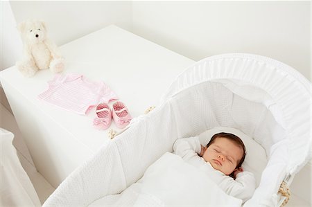 Baby sleeping in a bassinet Stock Photo - Premium Royalty-Free, Code: 614-03684138