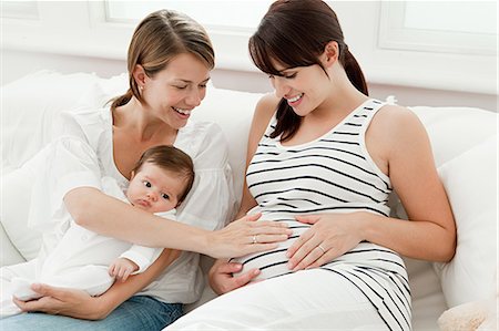 Mother with baby and pregnant friend Stock Photo - Premium Royalty-Free, Code: 614-03684162