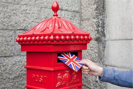 red flag - Person putting postcard in post box, London Stock Photo - Premium Royalty-Free, Code: 614-03684688