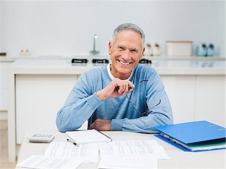Senior man doing home finances Stock Photo - Premium Royalty-Free, Code: 614-03763824