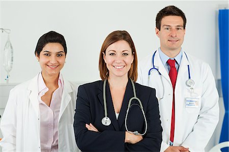 doctors with person in a suit - Portrait of three doctors Stock Photo - Premium Royalty-Free, Code: 614-03783625