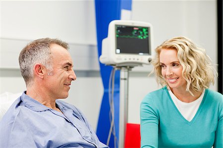 Wife visiting husband in hospital Stock Photo - Premium Royalty-Free, Code: 614-03783660