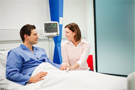 Wife visiting husband in hospital Stock Photo - Premium Royalty-Free, Code: 614-03783662