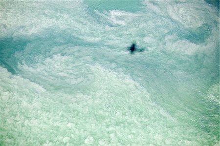 rhode island - Airplane shadow over cloud, Newport County, Rhode Island, USA Stock Photo - Premium Royalty-Free, Code: 614-03818643