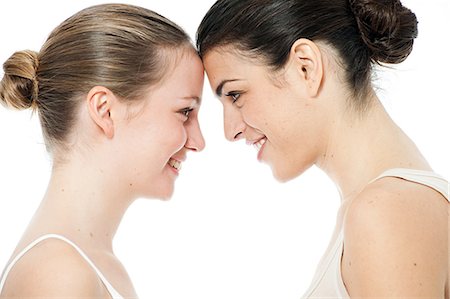 fresh-faced - Two young women face to face Stock Photo - Premium Royalty-Free, Code: 614-03903543