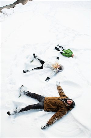 scenery children not illustration - Family making snow angels Stock Photo - Premium Royalty-Free, Code: 614-03981311
