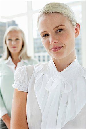 simsearch:6108-06907153,k - Two businesswomen in office, portrait Stock Photo - Premium Royalty-Free, Code: 614-03981651