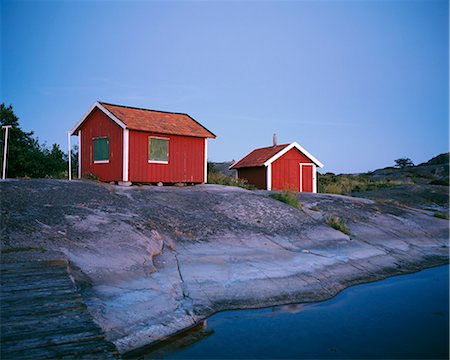 exterior color for house in the forest - Two red cottages in the archipelago of Stockholm, Sweden. Stock Photo - Premium Royalty-Free, Code: 6102-03748005