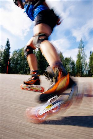 A woman on roller blades. Stock Photo - Premium Royalty-Free, Code: 6102-03749015