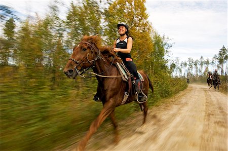 A woman riding a horse. Stock Photo - Premium Royalty-Free, Code: 6102-03751105