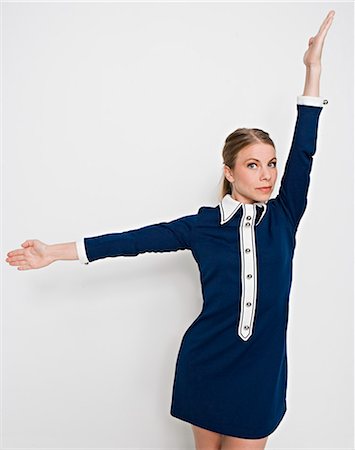 flight attendant studio - A Scandinavian woman pointing out the direction. Stock Photo - Premium Royalty-Free, Code: 6102-03865785