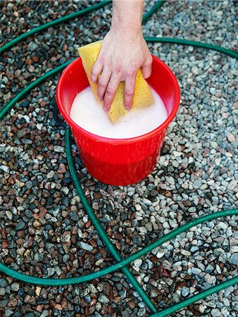 A man washing a car, Sweden. Stock Photo - Premium Royalty-Free, Code: 6102-03865701