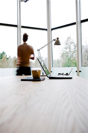 sweden window lamp - A woman looking out through a window, Sweden. Stock Photo - Premium Royalty-Free, Code: 6102-03865856