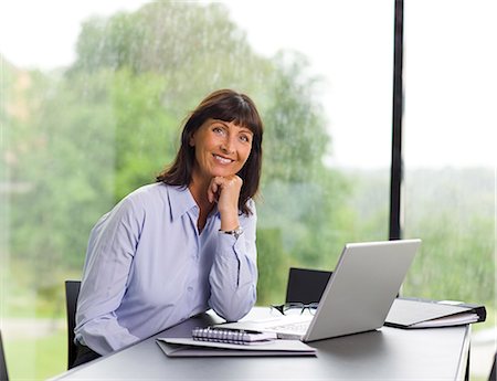 A woman using a computer, Sweden. Stock Photo - Premium Royalty-Free, Code: 6102-03866070