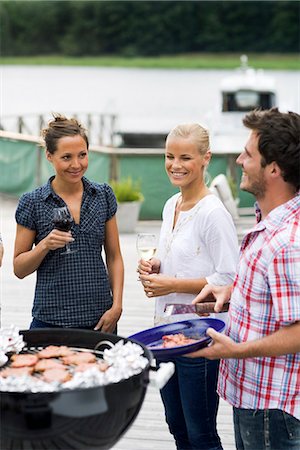 simsearch:6109-06781569,k - Friends having a barbeque, Sweden. Stock Photo - Premium Royalty-Free, Code: 6102-03866704
