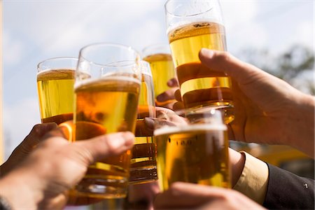simsearch:6113-06909171,k - Hands with glasses of beer, Budapest, Hungary. Stock Photo - Premium Royalty-Free, Code: 6102-03867258