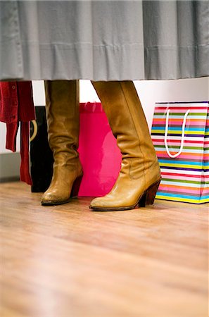 store change rooms - A pair of boots in a fitting room, Stockholm, Sweden. Stock Photo - Premium Royalty-Free, Code: 6102-03826852